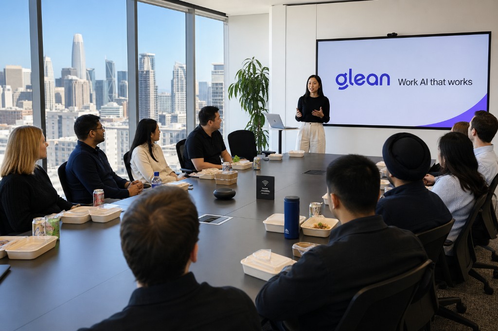 Team gathered in a San Francisco conference room for a Glean Lunch & Learn, with a presenter and the Work AI that works message on screen.